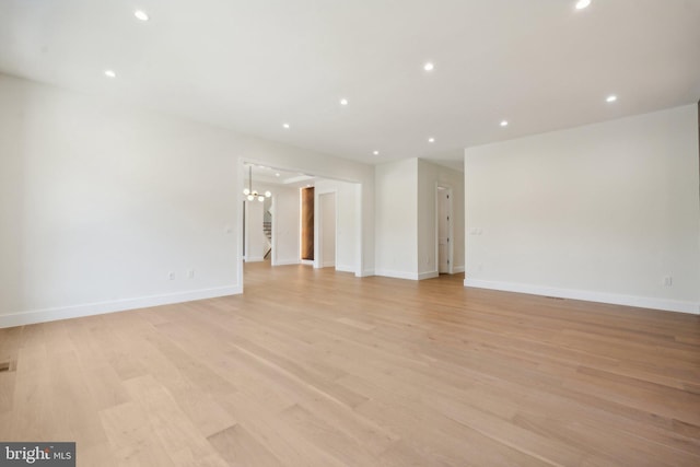 spare room with light hardwood / wood-style floors