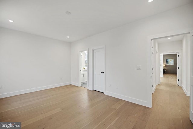 spare room with light hardwood / wood-style flooring