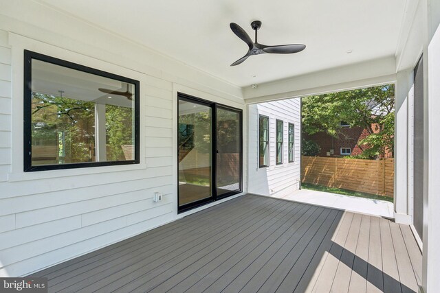 exterior space with ceiling fan