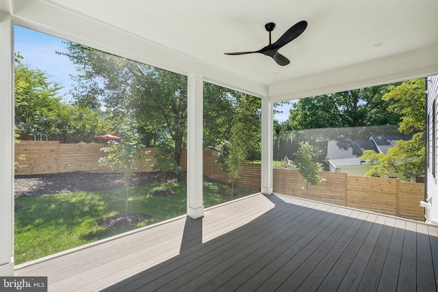 deck featuring a lawn and ceiling fan