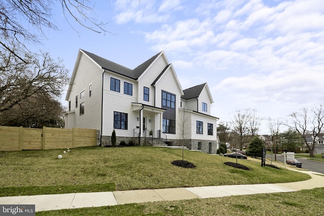 view of front facade with a front lawn