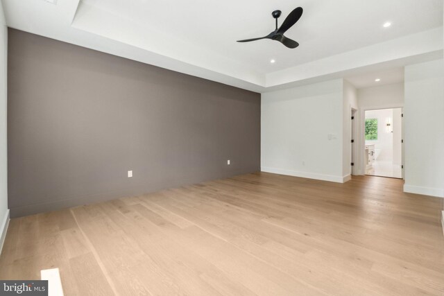 unfurnished room featuring light wood-type flooring and ceiling fan