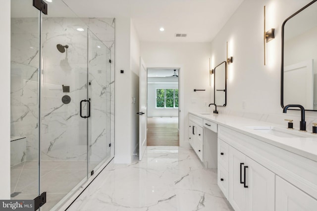 bathroom with tile patterned floors, vanity, and an enclosed shower