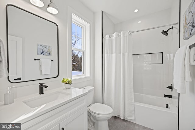 full bathroom featuring shower / tub combo, toilet, plenty of natural light, and vanity