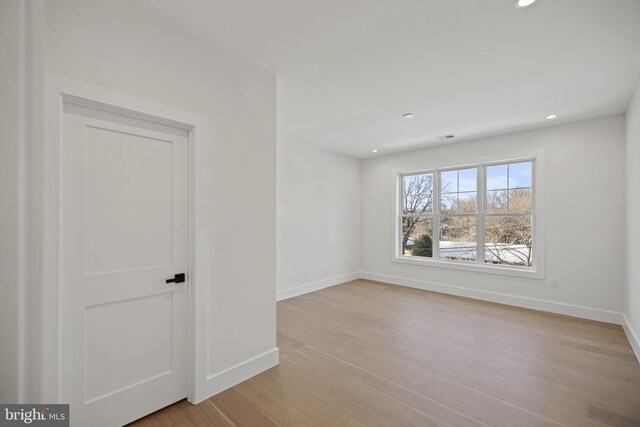 spare room with light hardwood / wood-style floors