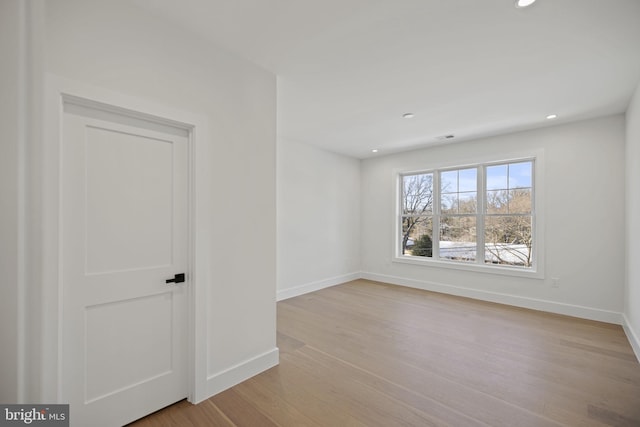 spare room with light wood-type flooring