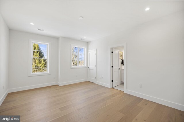 spare room with light hardwood / wood-style floors