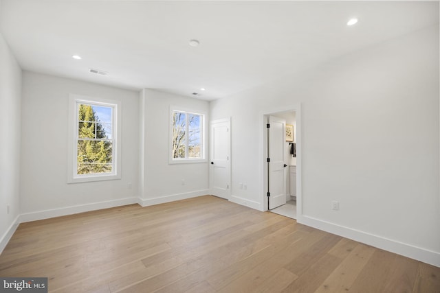 spare room with light hardwood / wood-style flooring