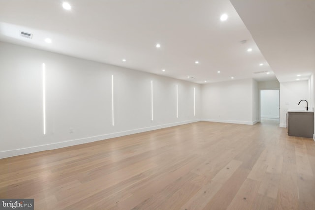 interior space featuring sink and light hardwood / wood-style floors