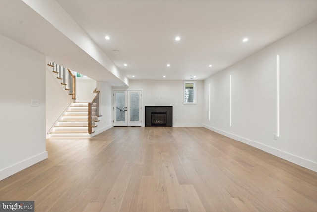 unfurnished living room with light hardwood / wood-style flooring