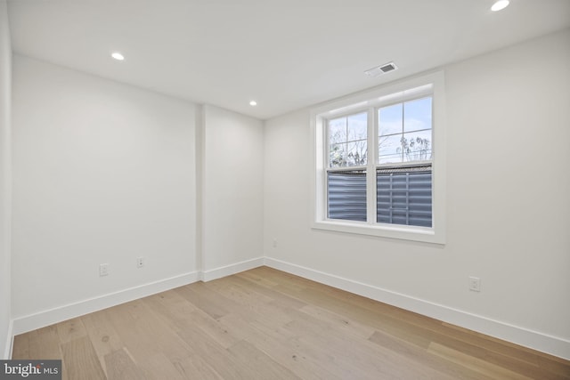 spare room with light hardwood / wood-style floors