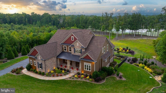 view of front of property with a yard