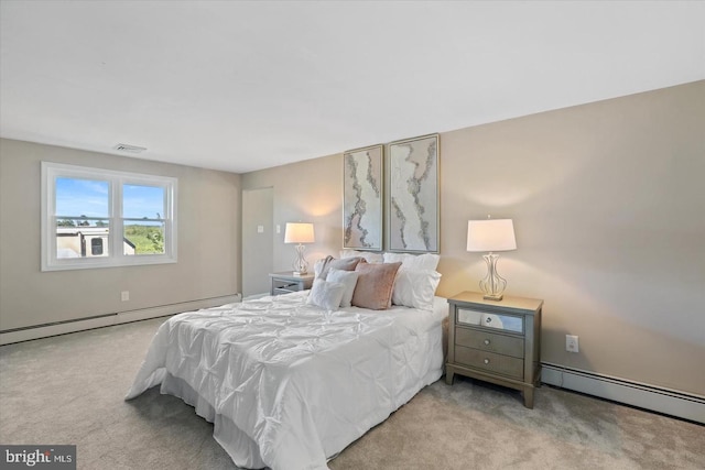 carpeted bedroom featuring a baseboard radiator