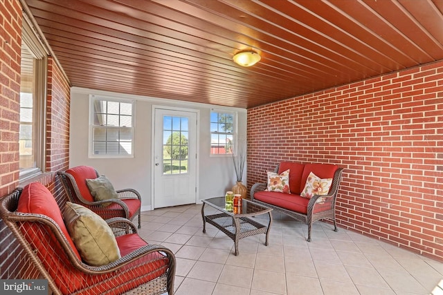 sunroom featuring wood ceiling