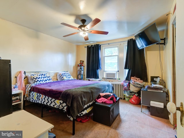 bedroom featuring radiator heating unit and ceiling fan