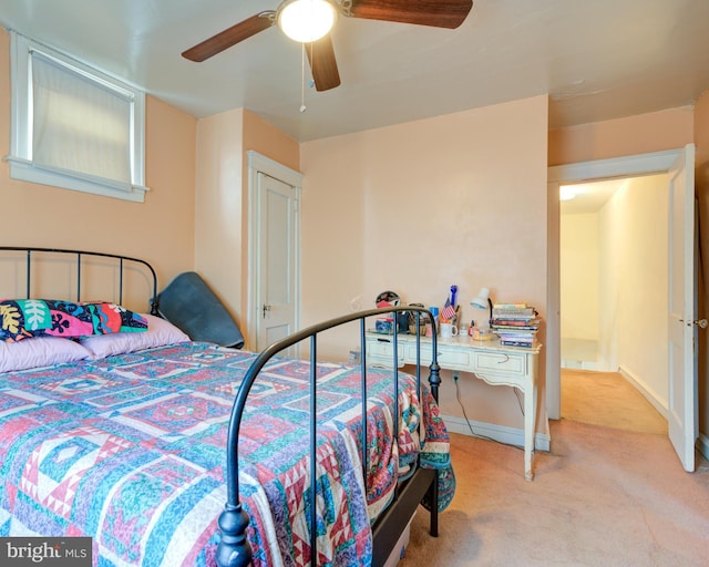 bedroom with ceiling fan and light colored carpet