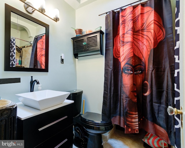 bathroom featuring vanity, tile patterned floors, and toilet