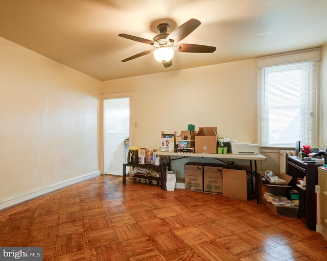 miscellaneous room with ceiling fan and light parquet floors