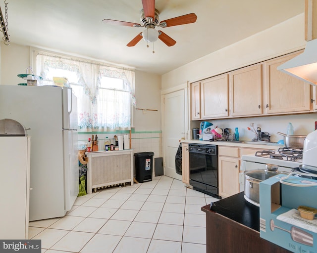 kitchen featuring white refrigerator, black dishwasher, light brown cabinetry, and a wealth of natural light