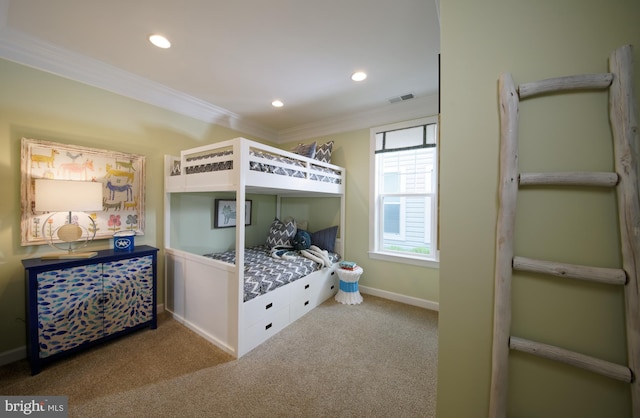 carpeted bedroom with ornamental molding