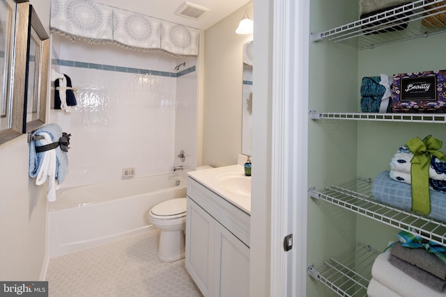 full bathroom with shower / bathtub combination, toilet, tile patterned floors, and vanity