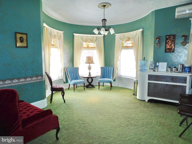 sitting room with a chandelier, carpet flooring, a wall mounted air conditioner, and a wealth of natural light