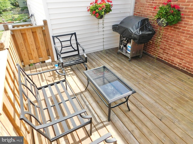 wooden deck with grilling area