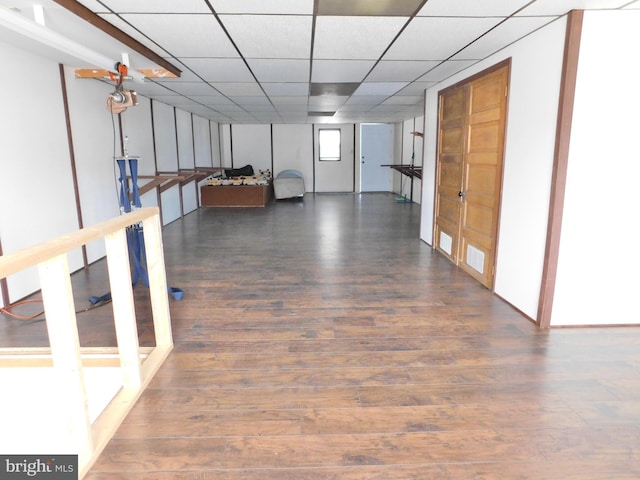 hallway with dark hardwood / wood-style flooring