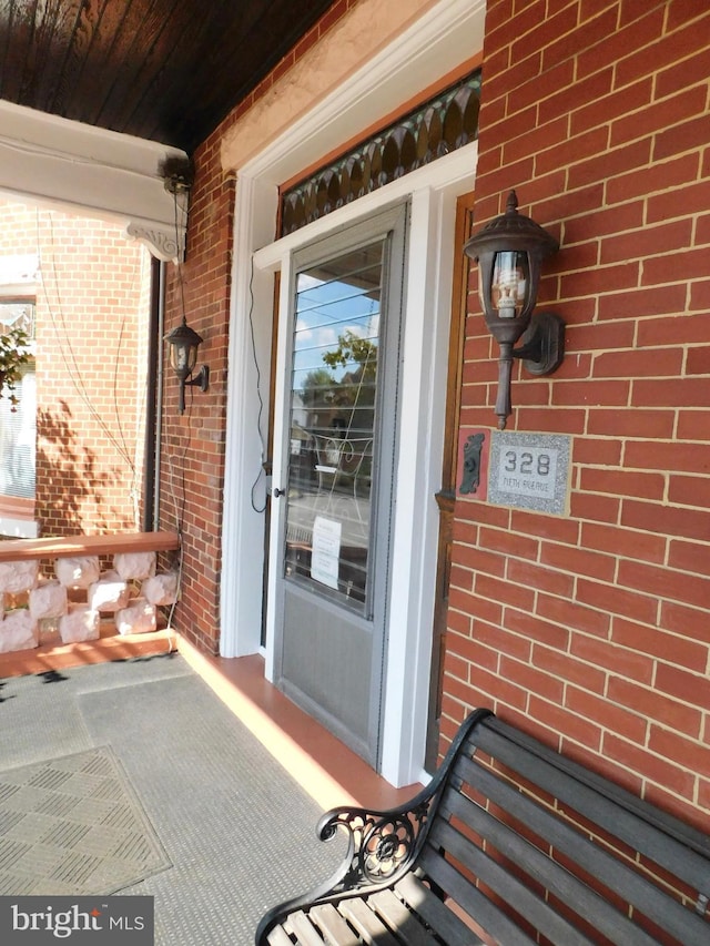 doorway to property featuring a porch