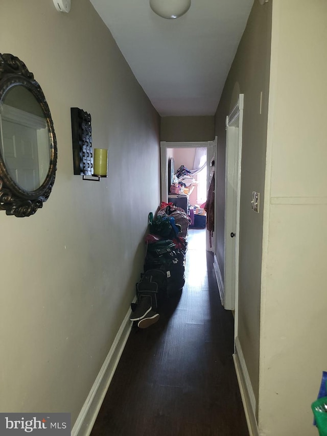 corridor with wood-type flooring