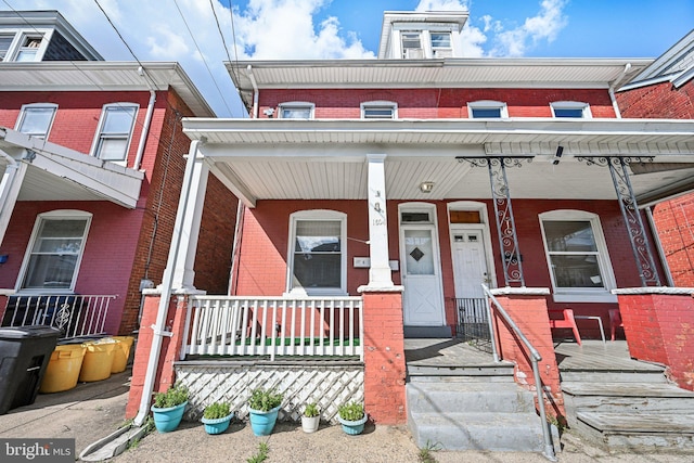 multi unit property featuring a porch