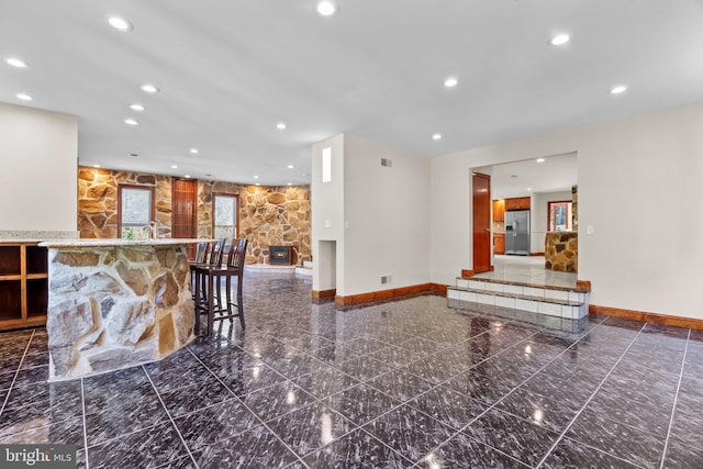 interior space with a stone fireplace