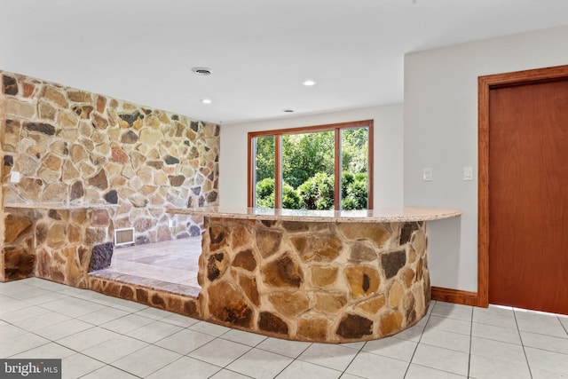 bar with light tile patterned floors