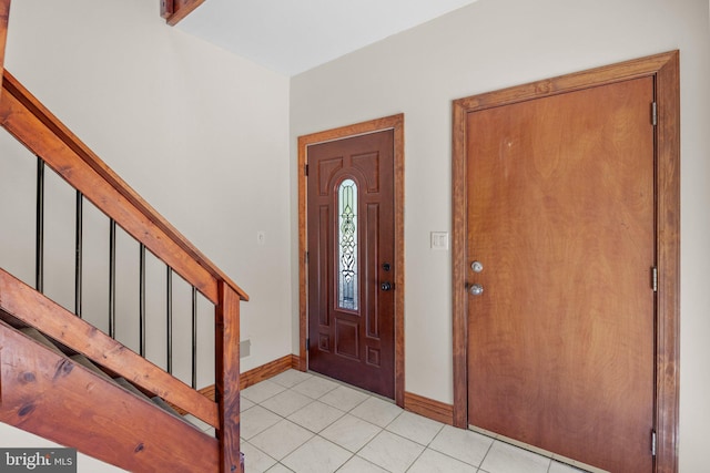 entrance foyer featuring light tile patterned flooring