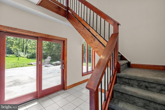 stairs with tile patterned floors