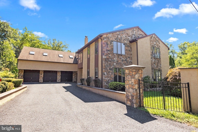 view of front facade with a front yard and a garage