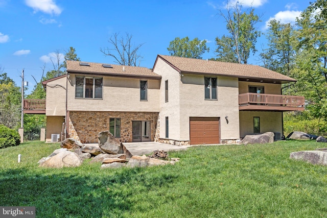 back of property featuring a balcony, a lawn, and a patio area