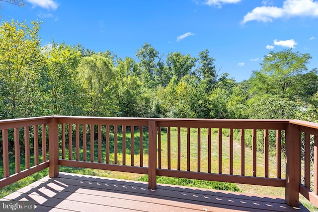 wooden terrace with a yard