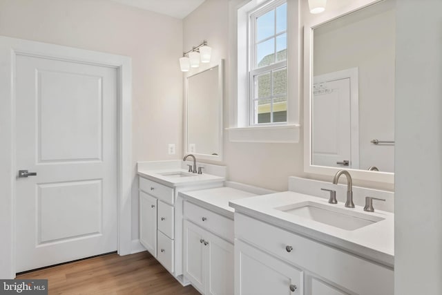 bathroom featuring vanity and hardwood / wood-style floors