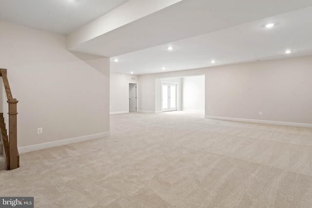 empty room featuring light colored carpet