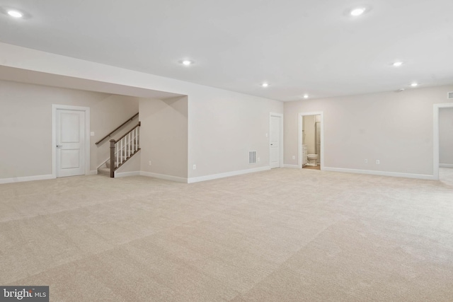 basement with light colored carpet