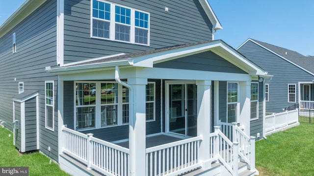 view of side of home featuring a sunroom