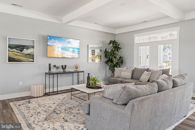 living room with beam ceiling and dark hardwood / wood-style flooring