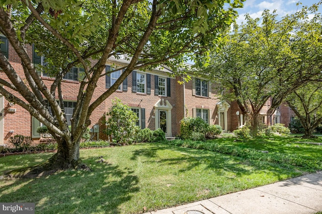 view of front of home with a front yard