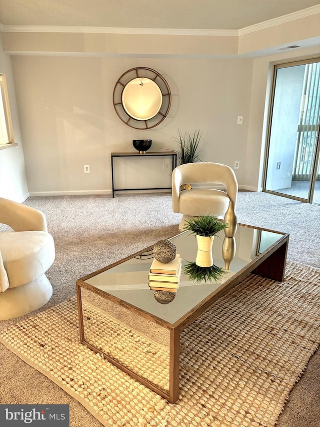 carpeted living room featuring ornamental molding