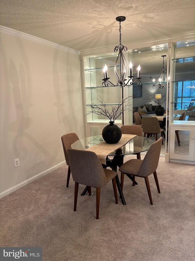 dining room with crown molding, carpet floors, a textured ceiling, and an inviting chandelier