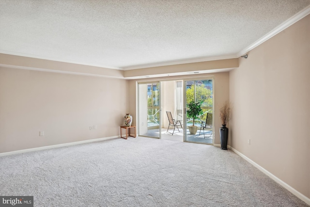 empty room featuring crown molding, carpet floors, and a textured ceiling