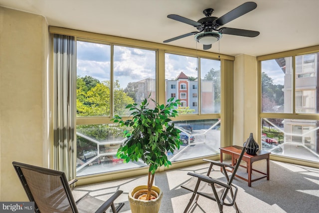 sunroom / solarium with ceiling fan