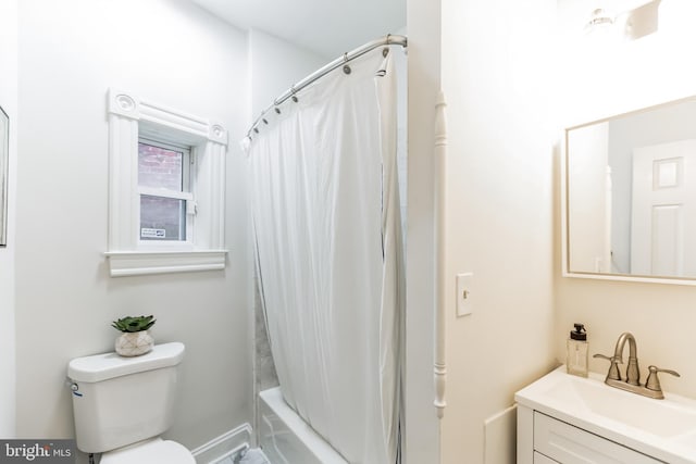 full bathroom featuring vanity, toilet, and shower / bath combo