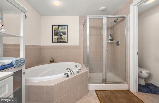 bathroom with tile patterned floors, toilet, and plus walk in shower